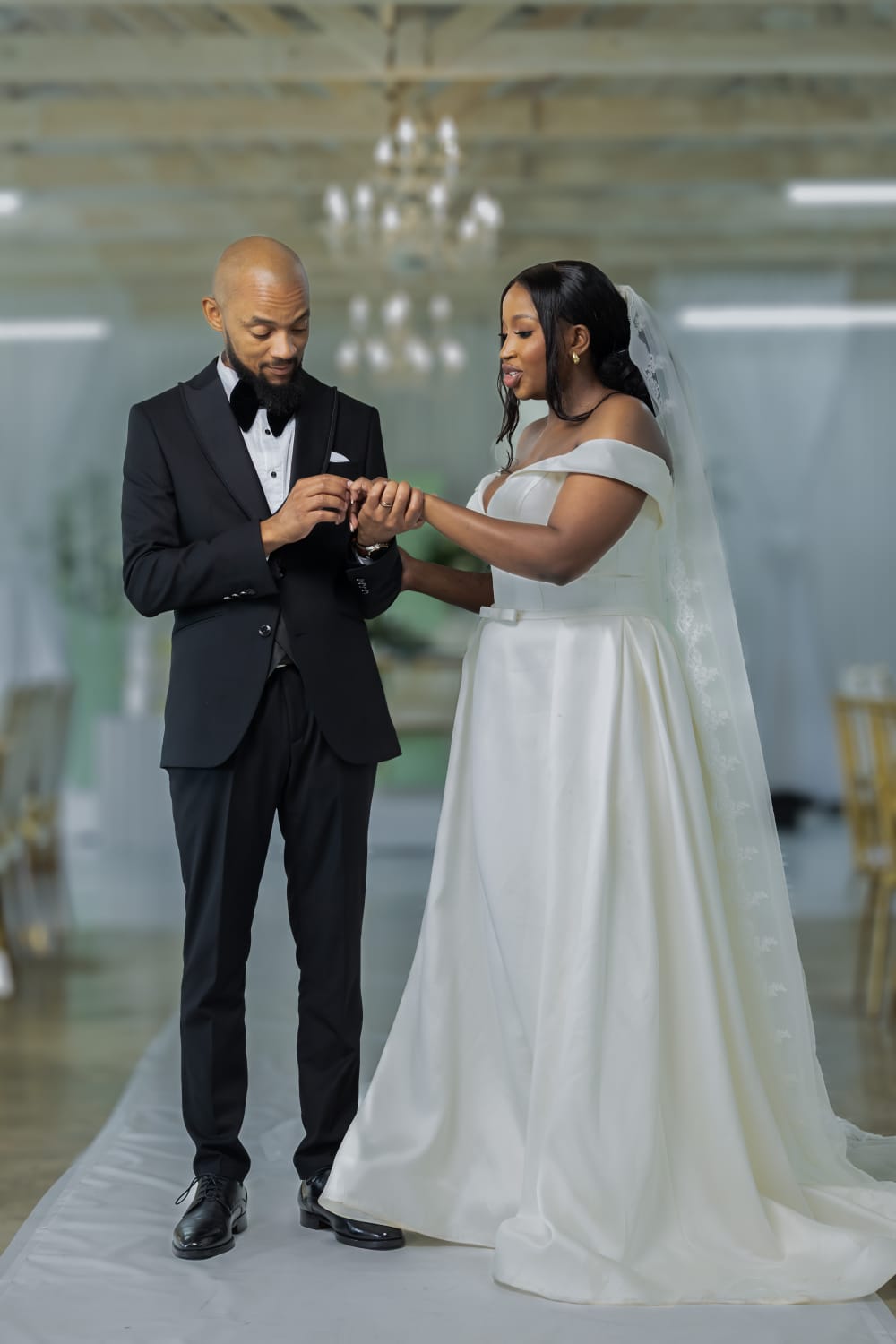 Bride and groom exchanging rings during their wedding ceremony